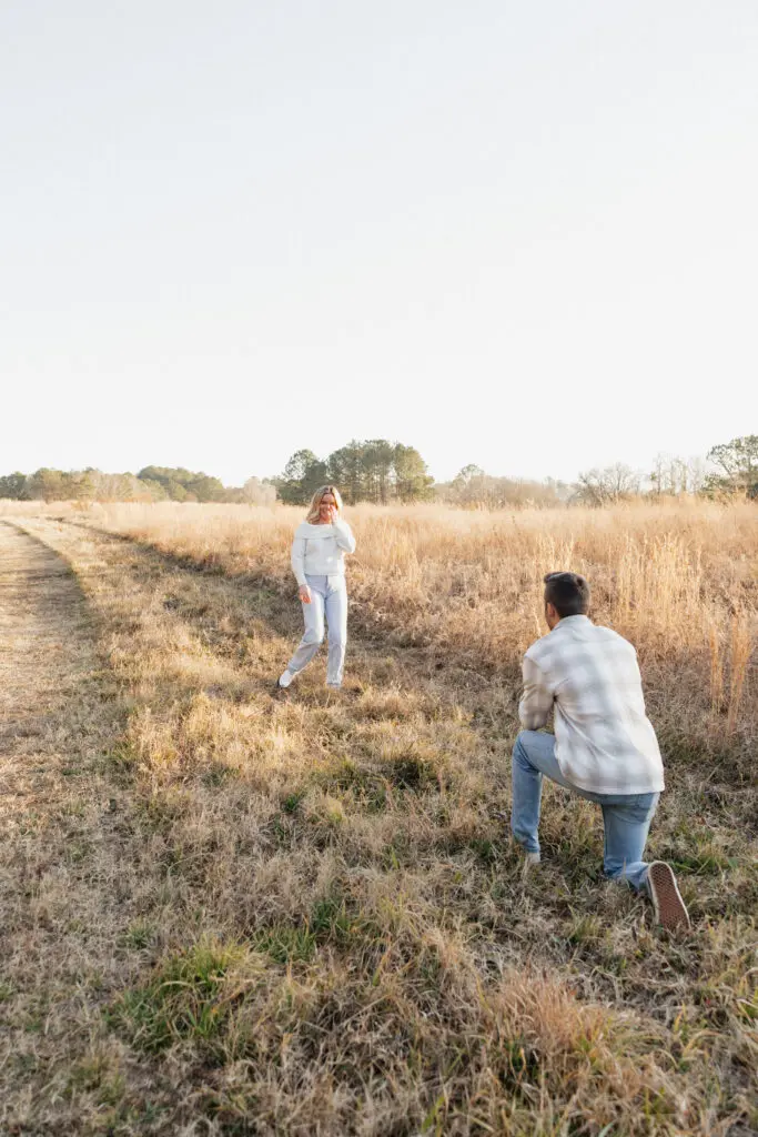 Romantic winter engagement session of a couple in neutral attire at Bells Mills field in Chesapeake, Virginia.
