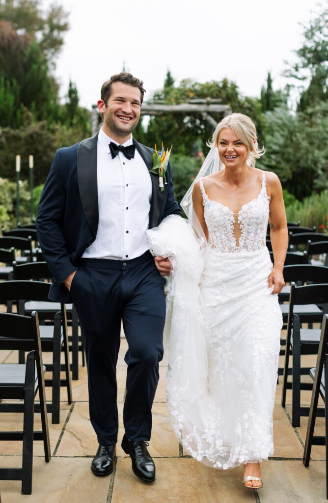 Bride and Groom walking down isle at Virginia Beach Wedding Venue 