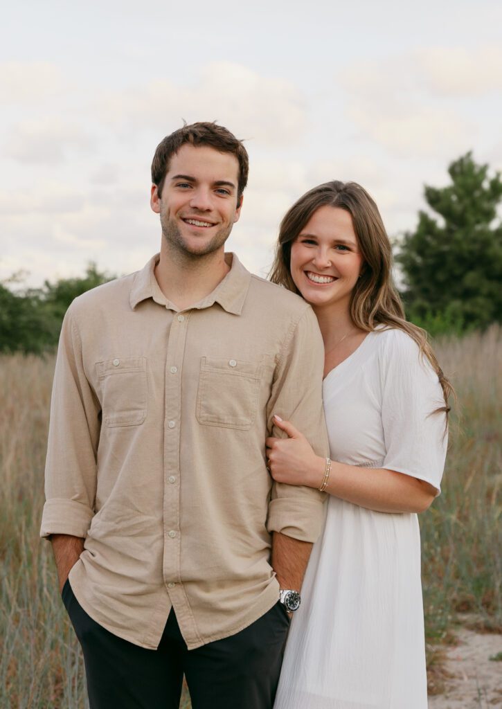 A couple smiling at the camera at Brock enviornmental center. 