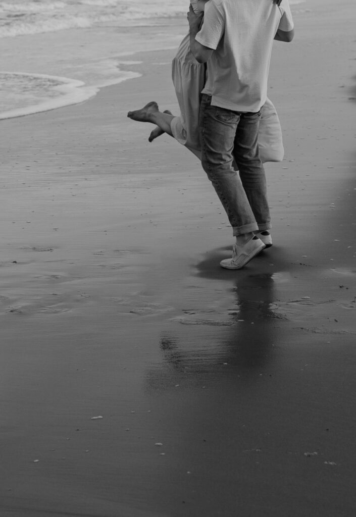 Black and White couple's photo at the beach. 