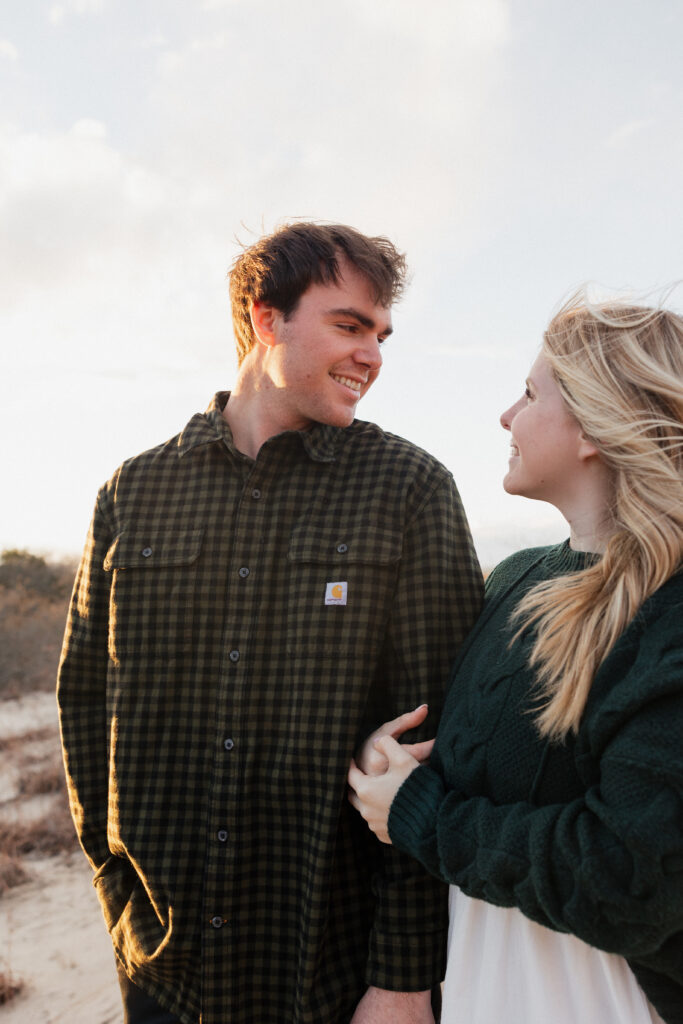 Guy and Girl in love taking engagement photos 